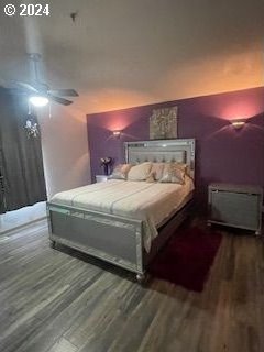 bedroom featuring hardwood / wood-style flooring and ceiling fan