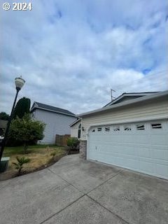 view of property exterior featuring a garage