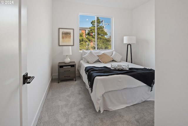 bedroom with light colored carpet