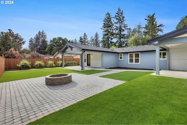 exterior space featuring a patio area and an outdoor fire pit