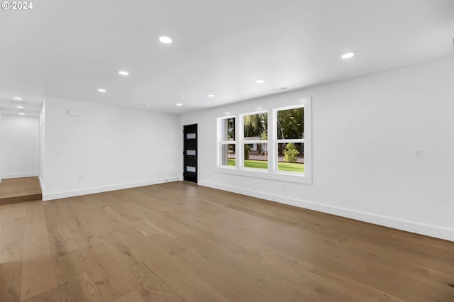 spare room with light wood-type flooring