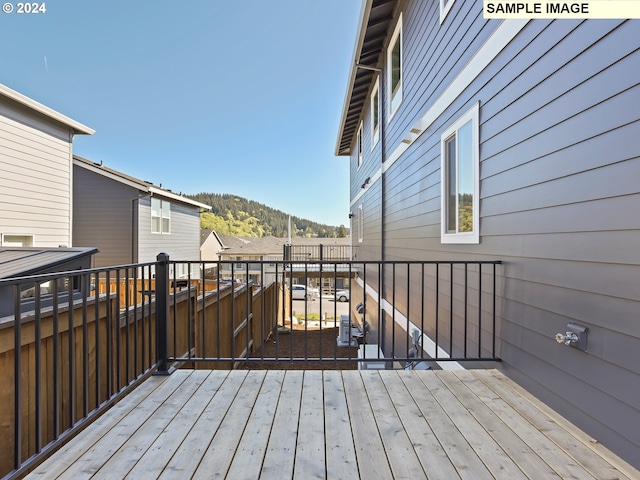 wooden deck featuring a mountain view