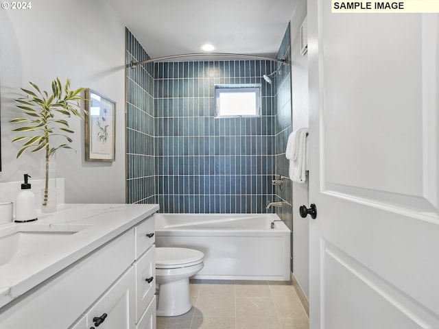 full bathroom with toilet, tiled shower / bath combo, vanity, and tile patterned floors