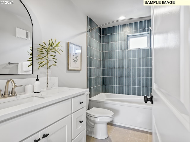 full bathroom with tiled shower / bath, vanity, toilet, and tile patterned floors