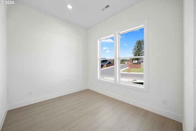 empty room with light wood-type flooring