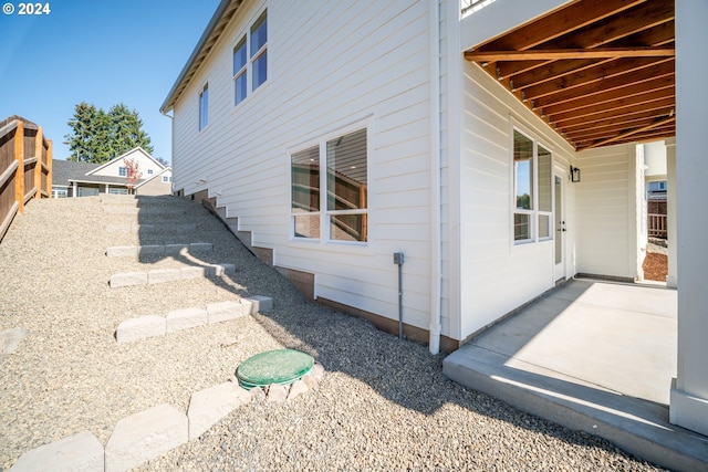 view of property exterior featuring a patio area