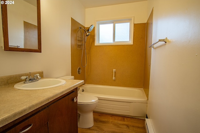 bathroom with toilet, vanity, wood finished floors, shower / bathing tub combination, and baseboard heating