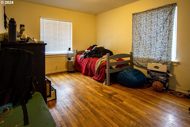 bedroom with wood-type flooring