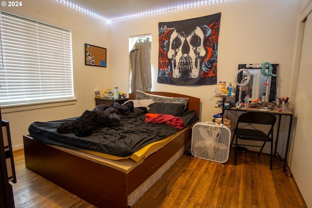 bedroom with hardwood / wood-style floors