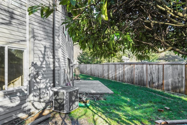 view of yard with a fenced backyard and cooling unit