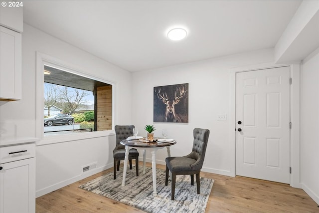 dining room with light hardwood / wood-style flooring