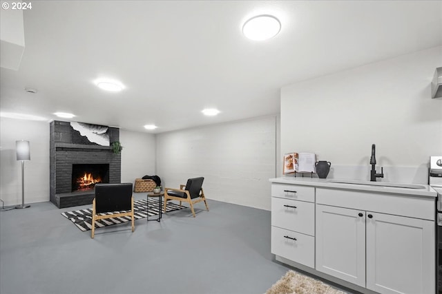 interior space with sink and a brick fireplace