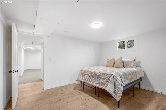 bedroom with light hardwood / wood-style floors