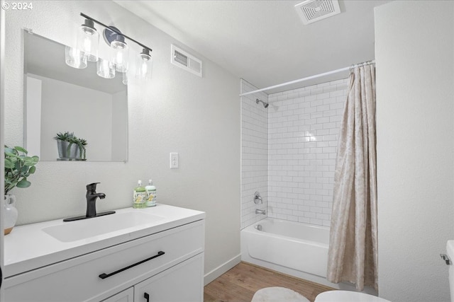 full bathroom featuring shower / bath combination with curtain, toilet, wood-type flooring, and vanity