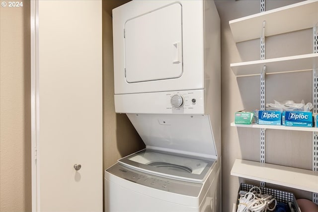 laundry room featuring stacked washer / dryer