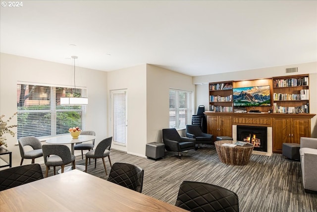 carpeted living room featuring plenty of natural light