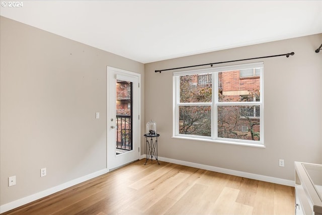 unfurnished room featuring light hardwood / wood-style floors