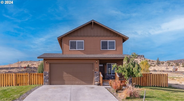 421 Little Lake Rd, Maupin, OR 97037 - view of front of home with concrete driveway, an attached garage, roof with shingles, stone siding, and board and batten siding