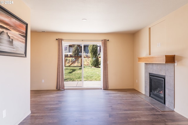 421 Little Lake Rd, Maupin, OR 97037 - unfurnished living room with wood finished floors, a tile fireplace, and baseboards