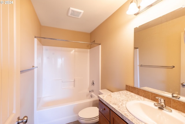 full bathroom featuring bathing tub / shower combination, vanity, and toilet