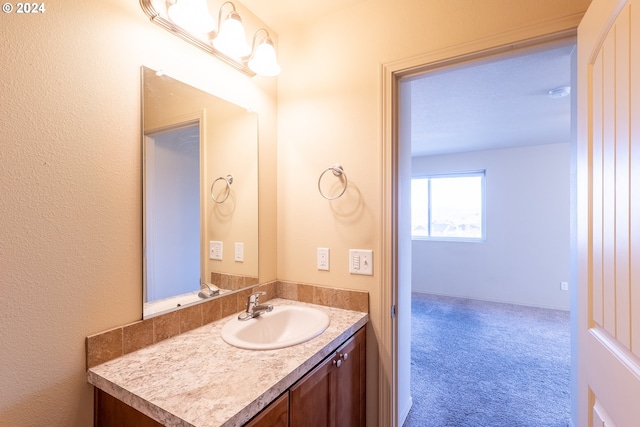 bathroom featuring vanity and a textured ceiling