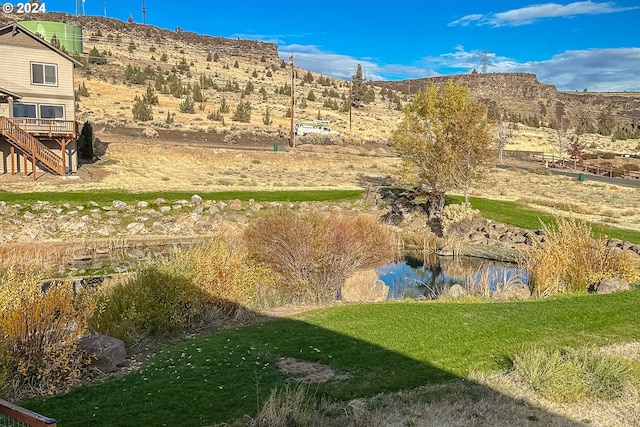 view of mountain feature with a water view