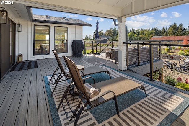 wooden deck with area for grilling