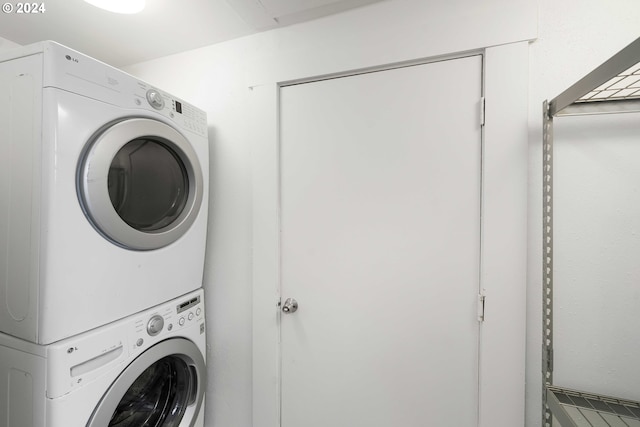 laundry area with laundry area and stacked washer and clothes dryer