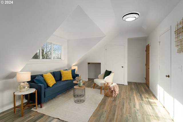 living room featuring wood finished floors and baseboards