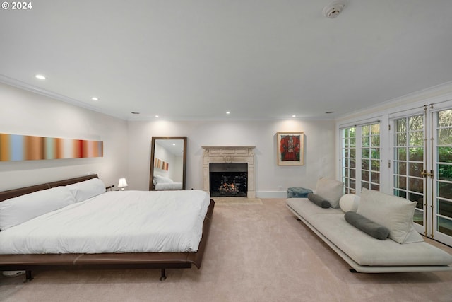 carpeted bedroom with french doors and crown molding