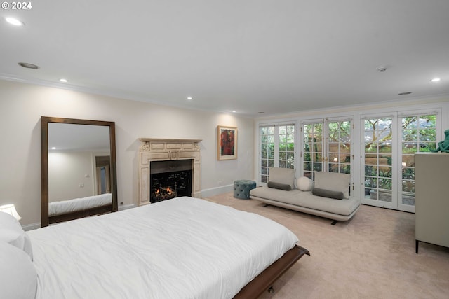 carpeted bedroom featuring access to outside, multiple windows, french doors, and ornamental molding