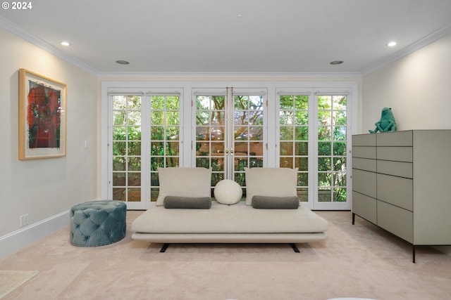 interior space featuring crown molding, a wealth of natural light, french doors, and light colored carpet