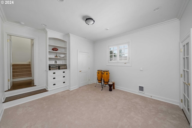 bedroom with light colored carpet and crown molding