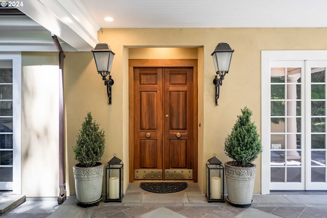 view of exterior entry featuring french doors