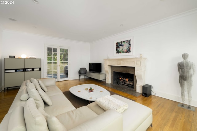 living room with crown molding and hardwood / wood-style flooring