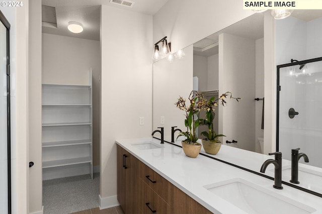 bathroom with vanity and walk in shower