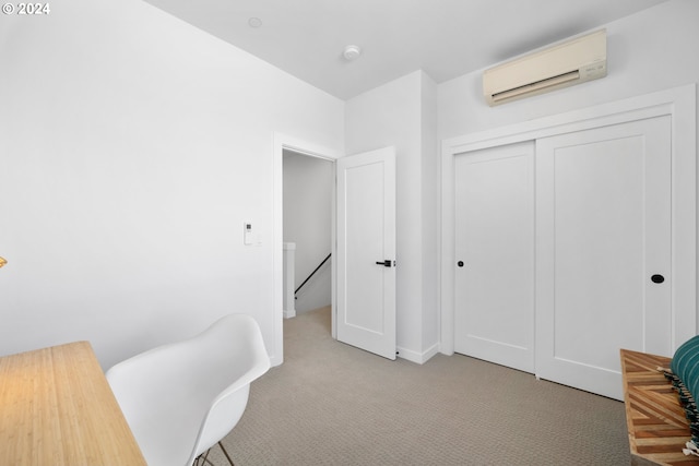 carpeted office featuring a wall unit AC