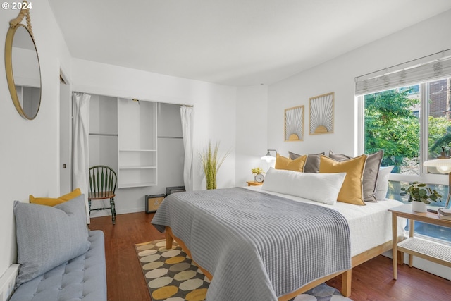 bedroom with hardwood / wood-style flooring