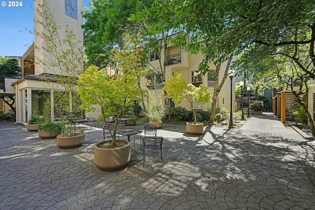 view of property's community with a patio