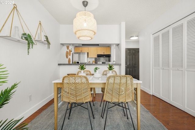 dining area featuring dark hardwood / wood-style floors