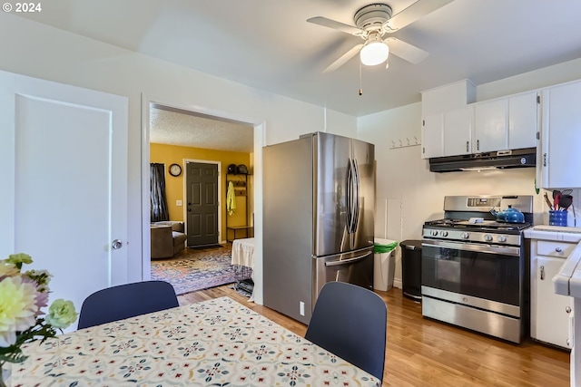 kitchen with ceiling fan, appliances with stainless steel finishes, light wood-type flooring, and white cabinetry