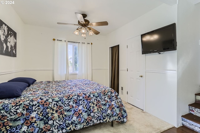 bedroom with ceiling fan and carpet floors