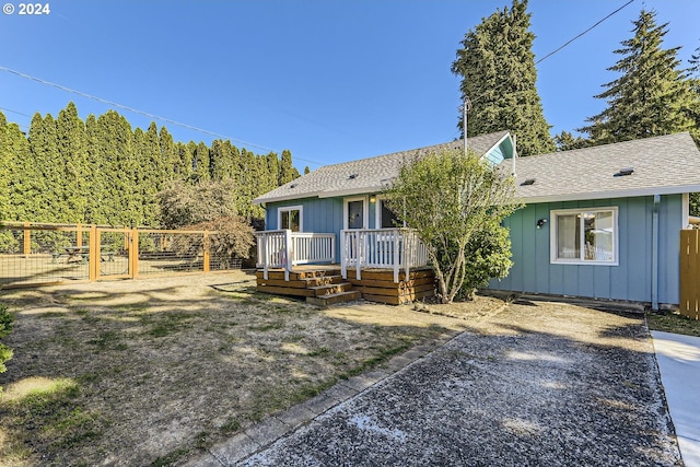 ranch-style house featuring a wooden deck