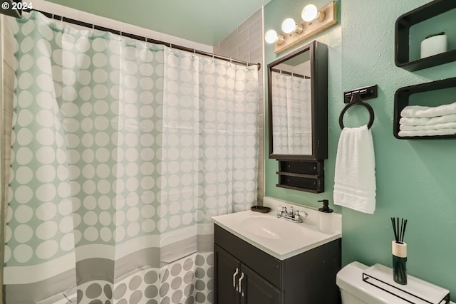 bathroom with vanity, toilet, and a shower with shower curtain