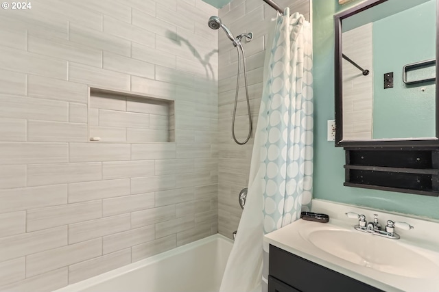 bathroom featuring shower / tub combo with curtain and vanity