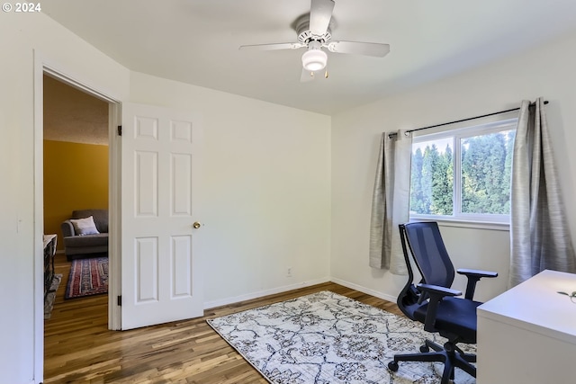 office area featuring wood-type flooring and ceiling fan