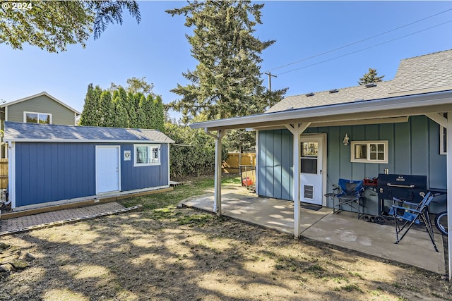 exterior space featuring a patio and a storage shed