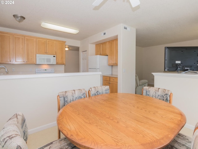 dining room featuring ceiling fan