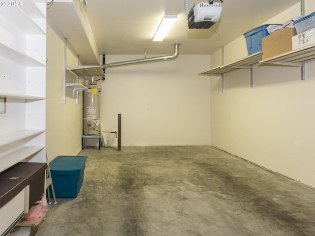 garage featuring a garage door opener and water heater