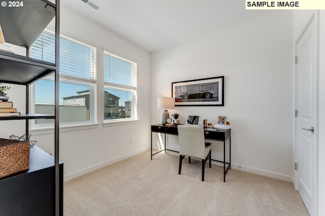 office space with light colored carpet